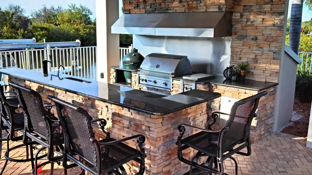 A grill standing proudly in a beautiful outdoor kitchen setup.