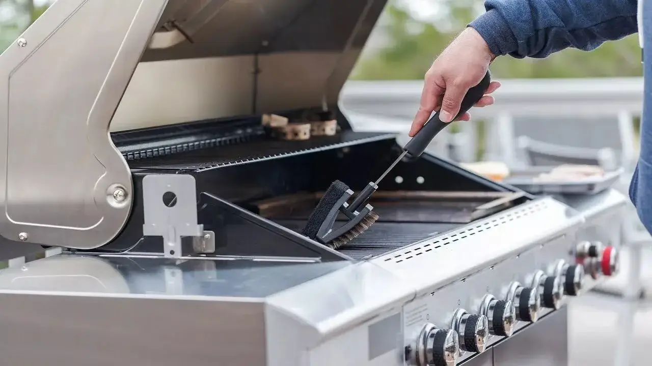 Craftsman carefully assembling a high-quality grill.